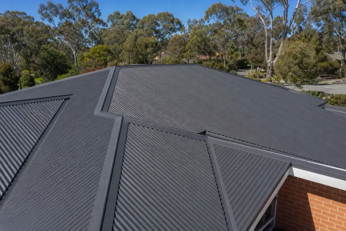 Completed metal roof on a two-storey brick home, Canberra