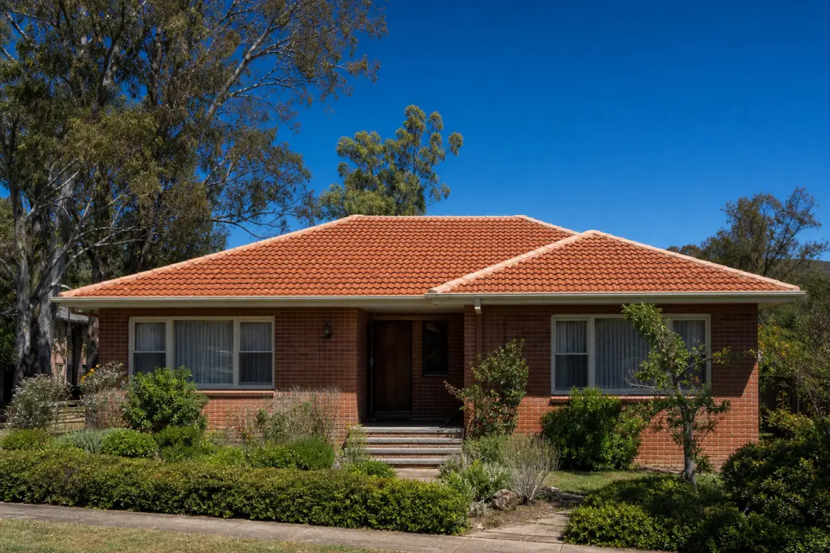 Restored terracotta tile roof with freshly repointed ridge capping โ Roof Restoration Canberra